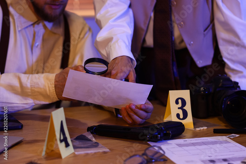 Obraz na plátně Forensic investigation and crime scene analysis, detectives examining evidence a