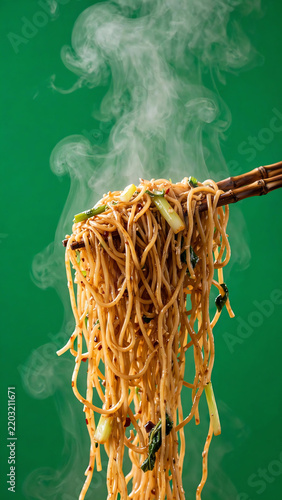 Steaming hot Chinese noodles being lifted by chopsticks with smooth upward motion against a professional green screen background