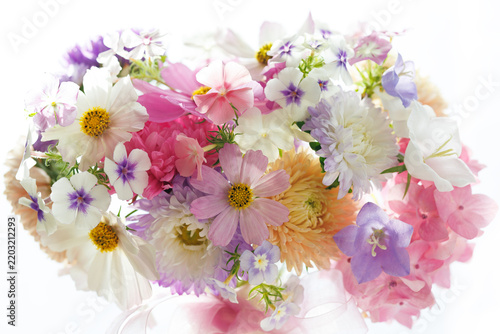 Beautiful bouquet of phlox, hydrangeas, cosmos and bellflowers in a vase closeup, floral background, blur, selective focus.