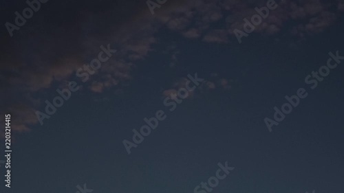 Clouds balls moving in the sky near the end of the night