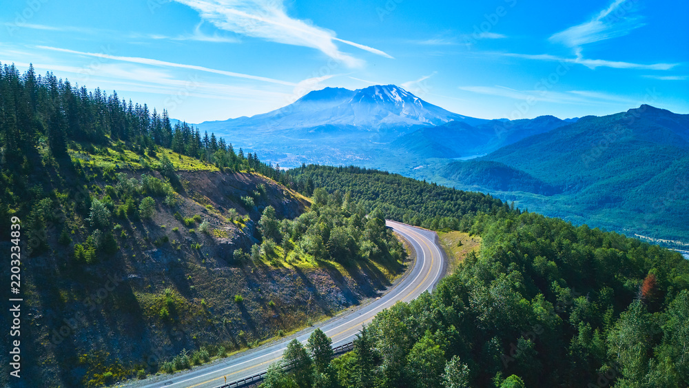 Fototapeta premium Aerial Winding Road Through Forest and Scenic Mt St Helens in Washington State