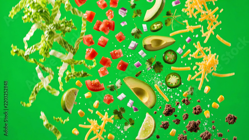 Fresh taco ingredients falling and tumbling in slow motion against a bright chroma key green screen background
