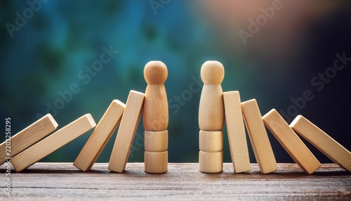 wooden figurines domino barrier separation conflict concept