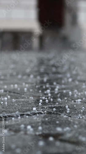 Close-Up Of Hail And Rain Pounding Cobblestones In The City Center Streets, Vertical Video