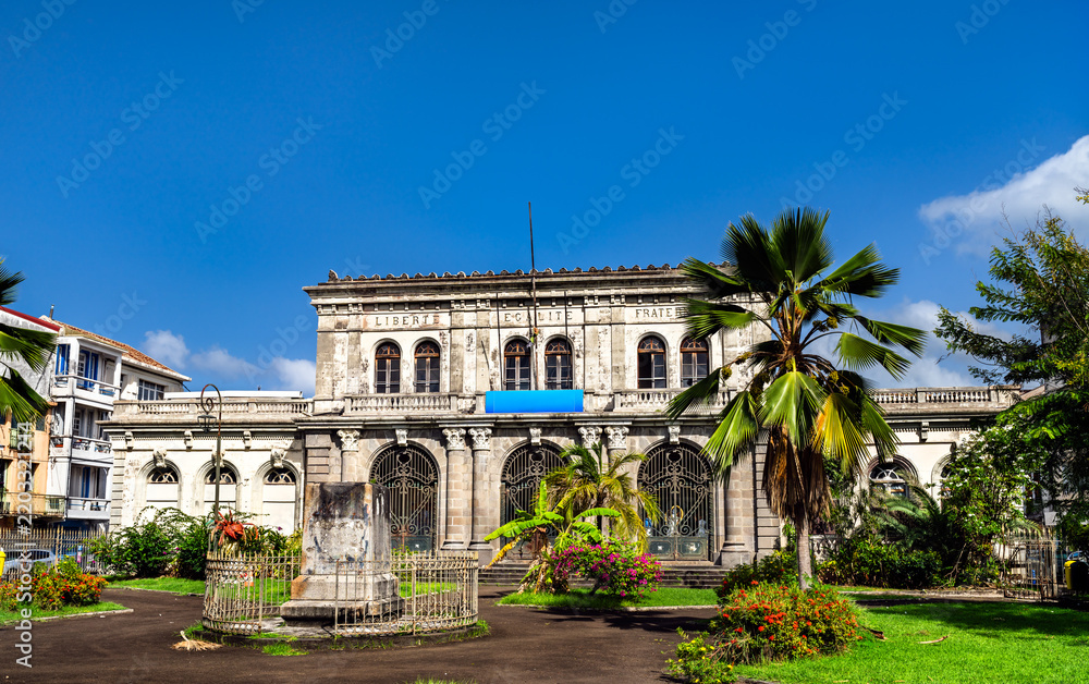Fototapeta premium Historic facade of the old Palais de Justice courthouse in Fort-de-France, Martinique under a blue sky.