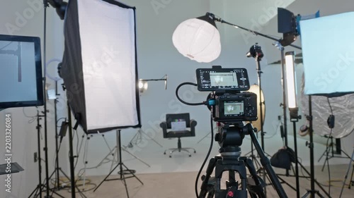 Professional camera on tripod in a film studio setup