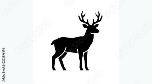 Silhouette of a majestic stag with large antlers standing proudly.