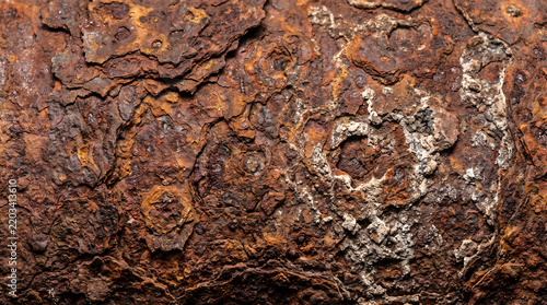 Close-up of rusted metal surface showing corrosion patterns and texture for industrial design projects