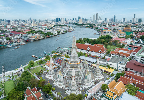 Aerial view of high-rises and Wat Arun along the Chao Phraya River, Bangkok, Thailand