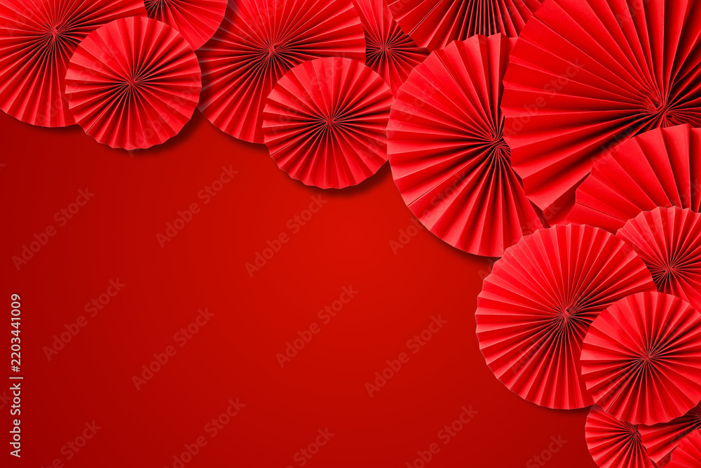 Fototapeta premium Vibrant red fans set a festive backdrop