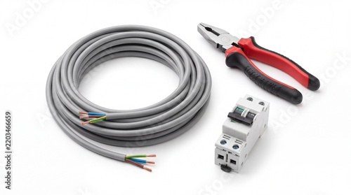 Coiled grey electrical cable with pliers and circuit breaker on white background