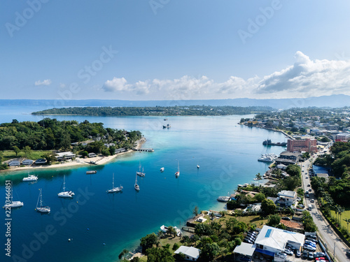 Aerial view of Port Vila harbour with sailboats, Iririki Island on the left and Port Vila CBD waterfront in the distance, Vanuatu