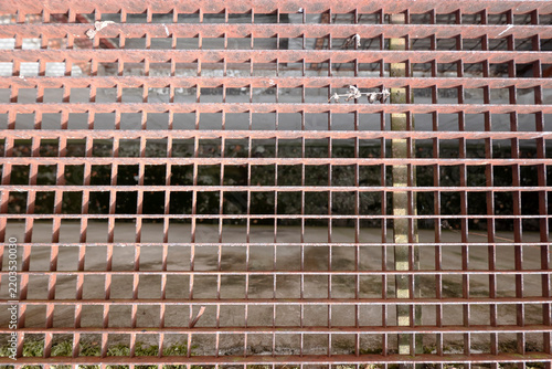 Metal grating floor for safe passage over a floor opening