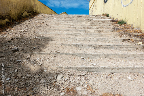 Old, broken concrete stairs of an abandoned building.