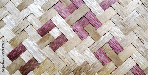 Traditional Handwoven Bamboo Surface with Magenta and Natural Accents