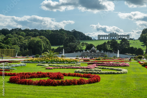 View across Great Parterre garden towards Gloriette hill at Schonbrunn Palace in Vienna, Austria. 19.09.2019