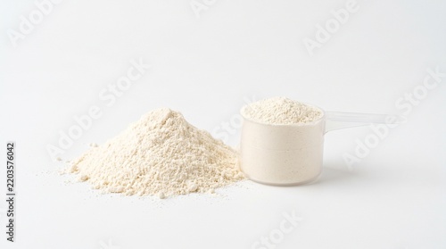 A Portion Of Protein Powder Supplement Placed In A Measuring Scoop Next To A Small Pile Of Dry Nutritional Fitness Ingredients