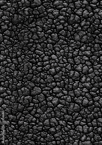 Dense black pebble surface with natural stone texture