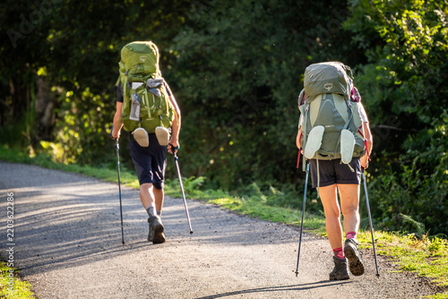 Two heavily laden hikers on the GR 10 (Great Pyrenees Crossing), Melles, Haute-Garonne department, Midi-Pyrénées, France