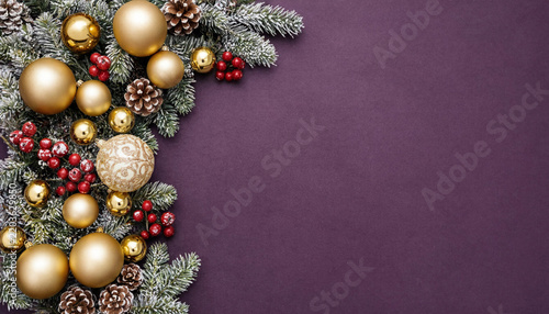 Christmas festive border with gold ornaments, pine cones and red berries on purple background