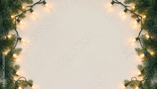 Christmas garland frame with warm string lights on a light beige background
