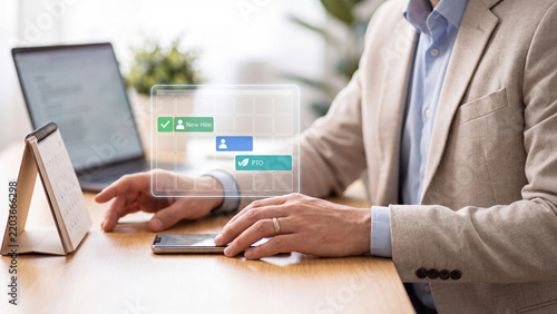 HR scheduling and employee leave planning concept, businessman using smartphone with virtual calendar showing new hire, staff shift and PTO beside laptop for workforce management
