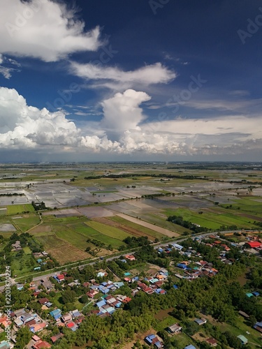 Aerial view of rice field countryside with blue sky and white clouds Agricultural Farmland