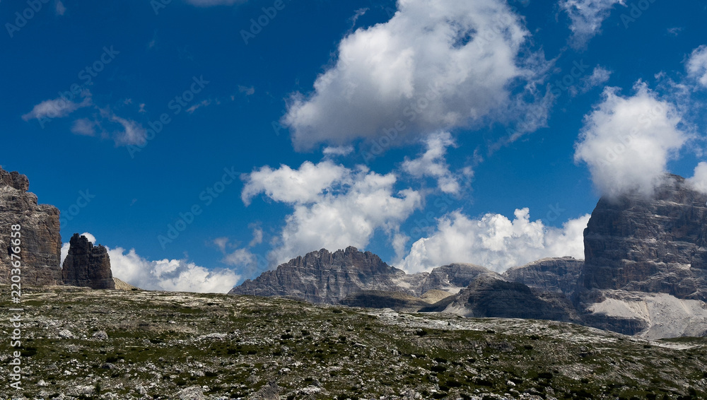 Obraz premium Mountain landscape panorama Tre Cime Mount against a blue summer background. 