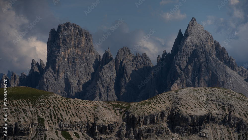 Obraz premium Mountain landscape panorama Tre Cime Mount against a blue summer background. 