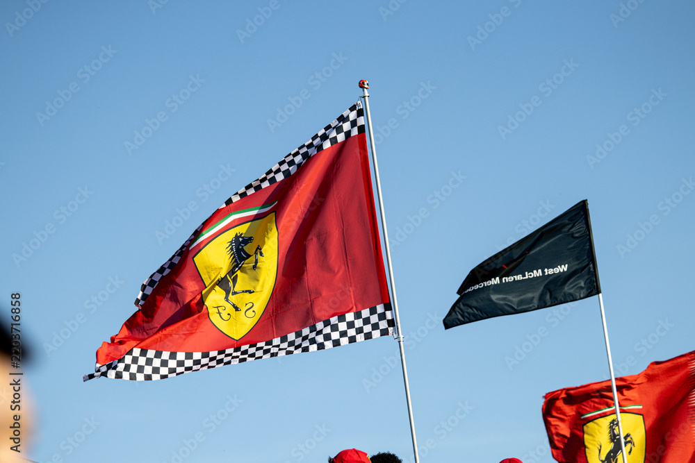 Obraz premium 24 May 2026, Montreal, Canada: Ferrari flags wave above Formula 1 fans at Grand Prix weekend. g.