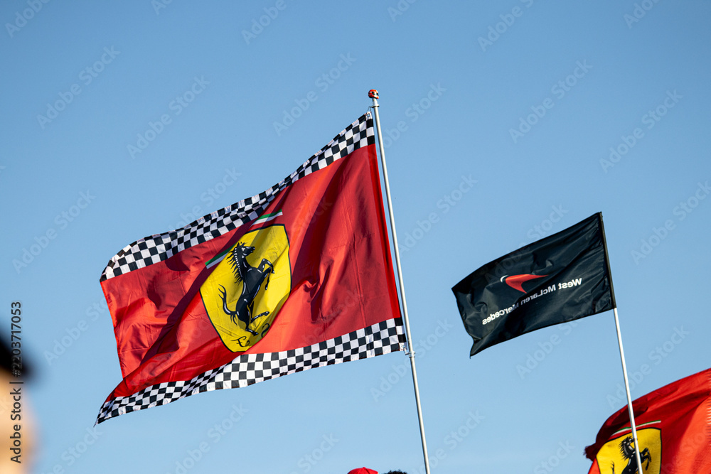 Obraz premium 24 May 2026, Montreal, Canada: Ferrari flags wave above Formula 1 fans at Grand Prix weekend. g.