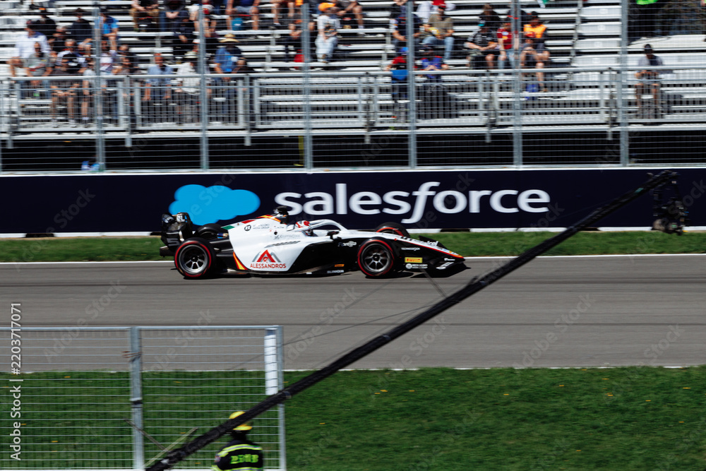 Obraz premium May 24, 2026, Montreal, Canada, Esteban Ocon races a Haas F1 car at Circuit Gilles-Villeneuve. g.