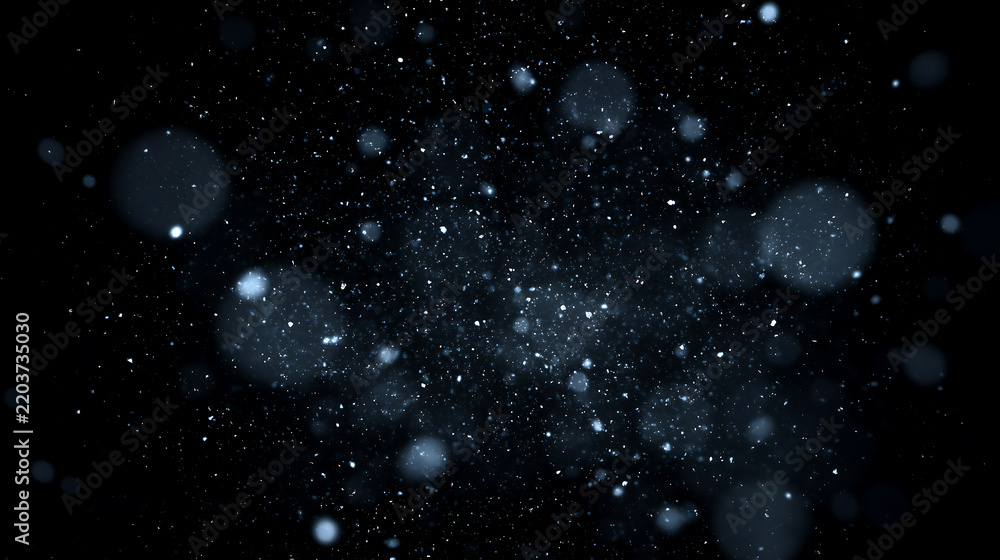 Obraz premium Abstract background of floating snow dust and frozen particles. Glowing white and blue winter bokeh effect on a black background. Icy particle field overlay.
