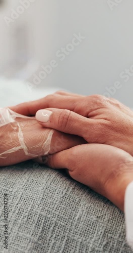 Doctor, holding hands and patient in clinic for comfort, empathy and prognosis of health update. Surgeon, console or person in hospital for support, compassion and medical recovery of chronic illness