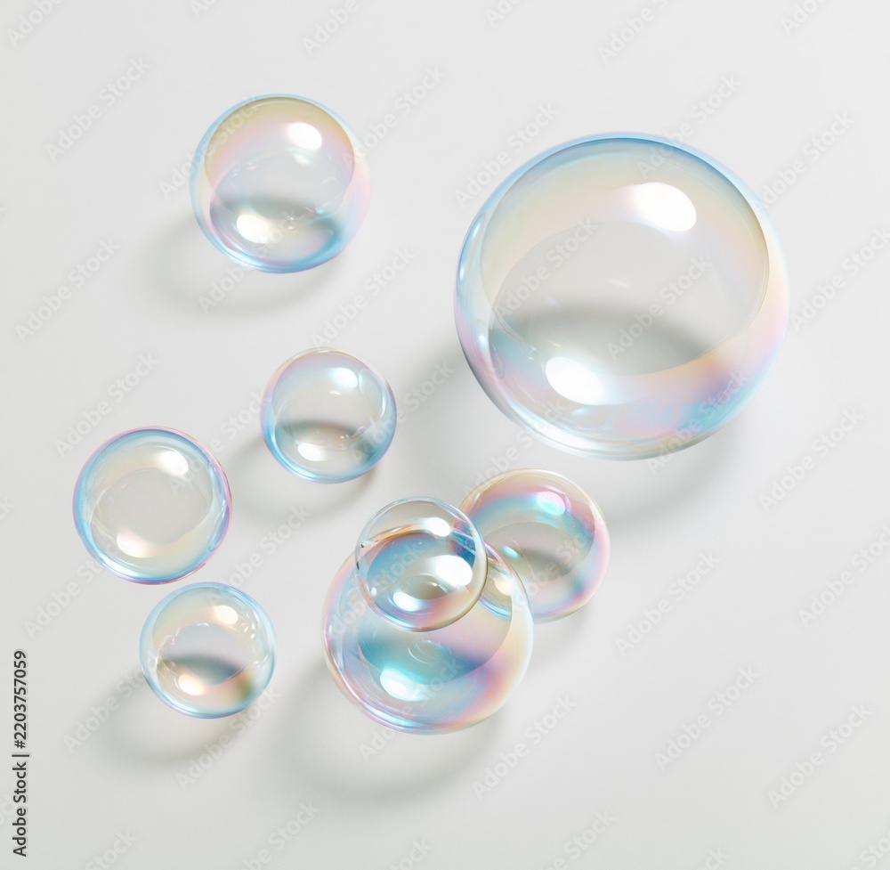 Obraz premium Colorful soap bubbles floating on white background