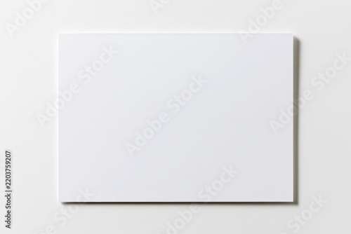 Studio shot of an unmarked white notecard with soft shadows and pristine simplicity