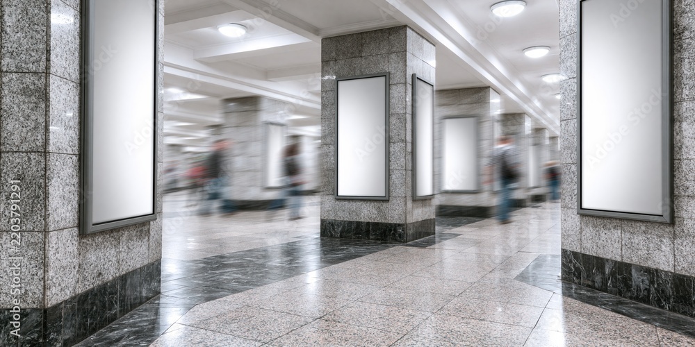 Obraz premium Empty metro station hallway with blank advertising boards