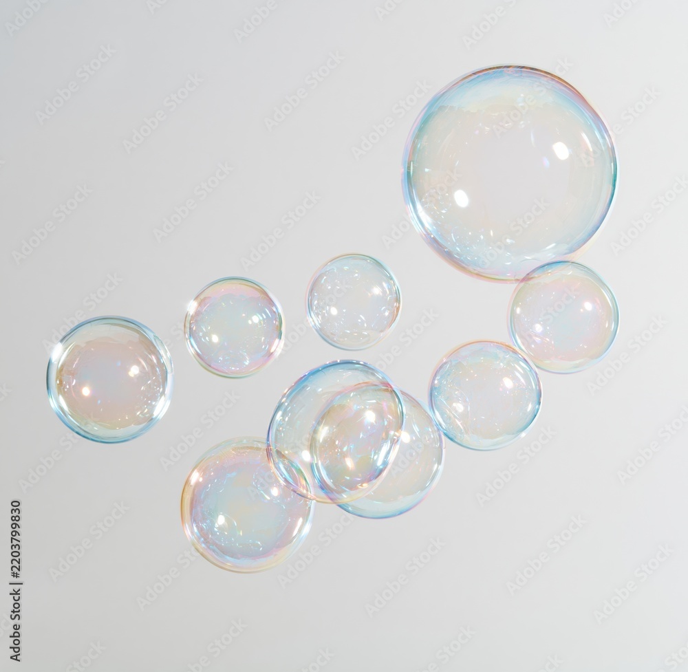 Obraz premium Colorful soap bubbles floating against a white background