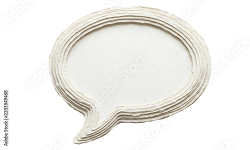 A detailed close up view of a white speech bubble constructed from many layers of paper isolated on a clear background