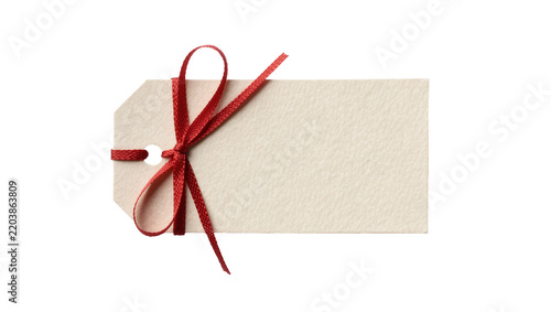 Blank beige paper gift tag with red ribbon bow, isolated on transparent background