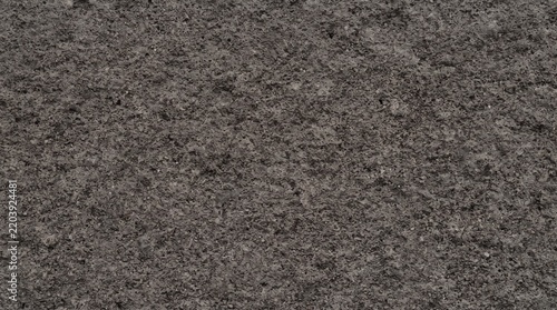 Dark gray textured stone surface background   