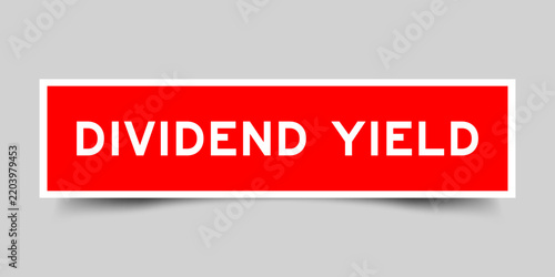 Red color square shape sticker label with word dividend yield on gray background