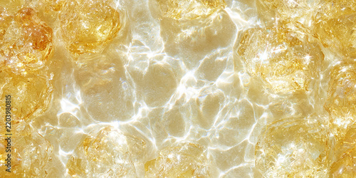 Golden Sunlit Water Flowing Over Translucent Stones
