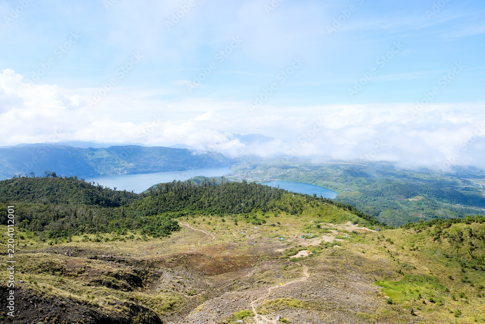 Fototapeta premium High angle view of Lake Talang and Lake Dibawah seen from the slopes of Mount Talang in Solok, West Sumatera, Indonesia