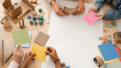 Student collaboration poster creative workshop craft paper teamwork classroom table