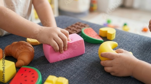 Vibrant squishy toys and foam food pieces for kids early learning activity and playroom background.
