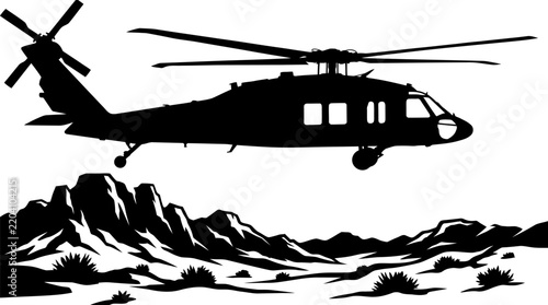 Black silhouette of a military helicopter flying over a mountainous desert landscape