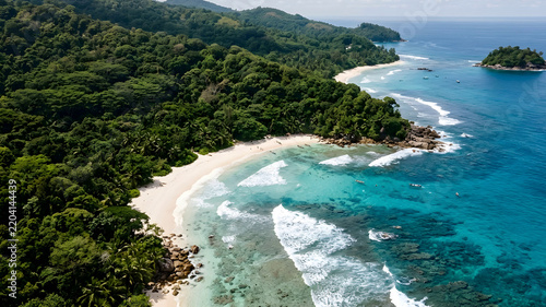 Aerial view of tropical coastline with lush forest bright daylight serene seascape natural beauty