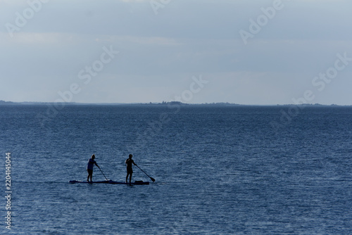 Two people on SUP in summer