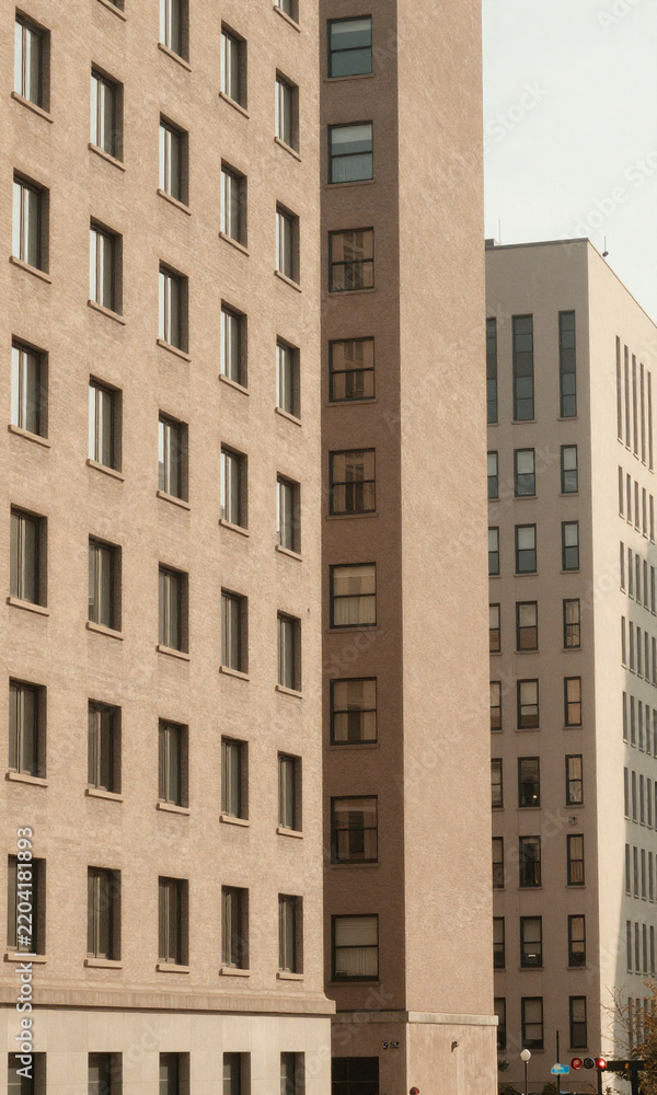 Obraz premium cityscape repetitive windows subtle shadows structured building facades serene urban